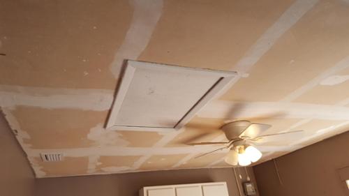 Client scraped popcorn off of this garage ceiling. We fixed the tape joints and sprayed a heavy knockdown texture to the ceiling.